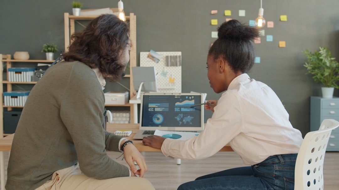 Technology startup team brainstorming in modern co-working space